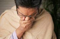 Man Coughing Due to Lead Exposure